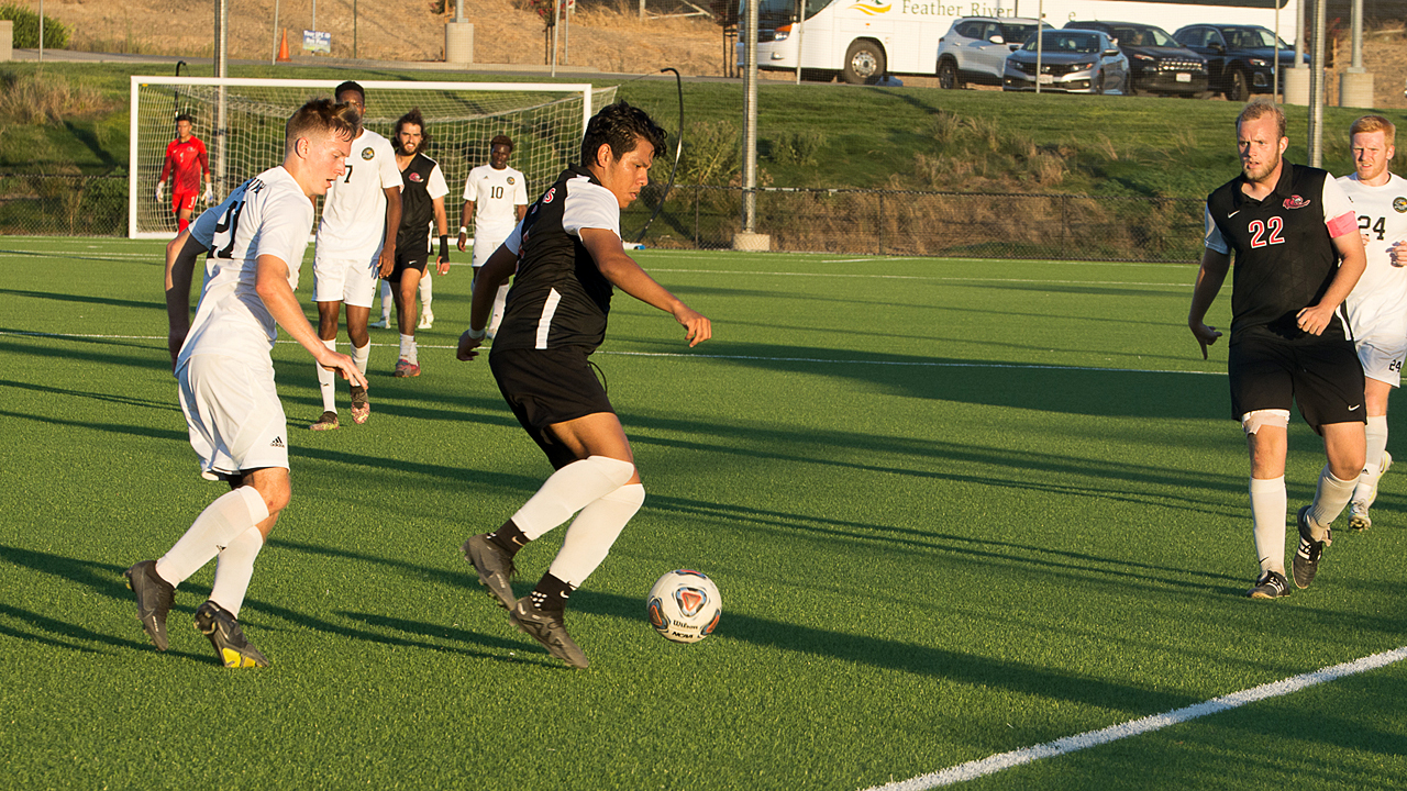 Edwin Zabala (center) scored twice in the Hawks' win over Feather River. (Photo by Alan Lewis)